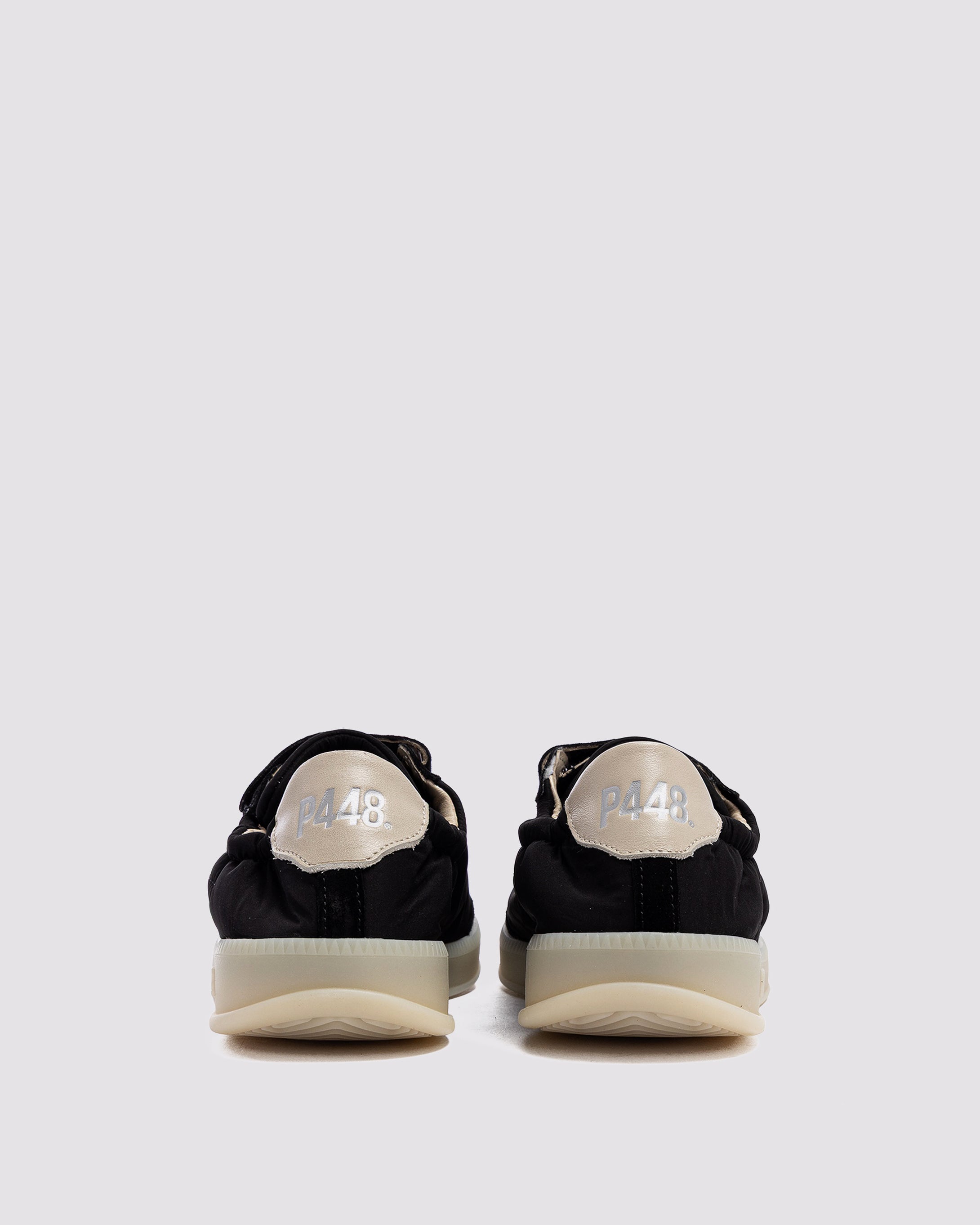 Side angle of nylon black sneakers