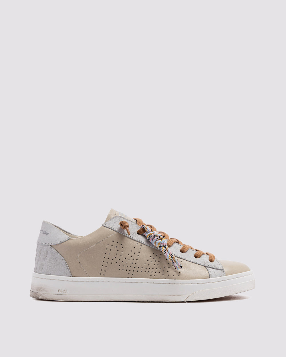 Side angle of beige sneakers