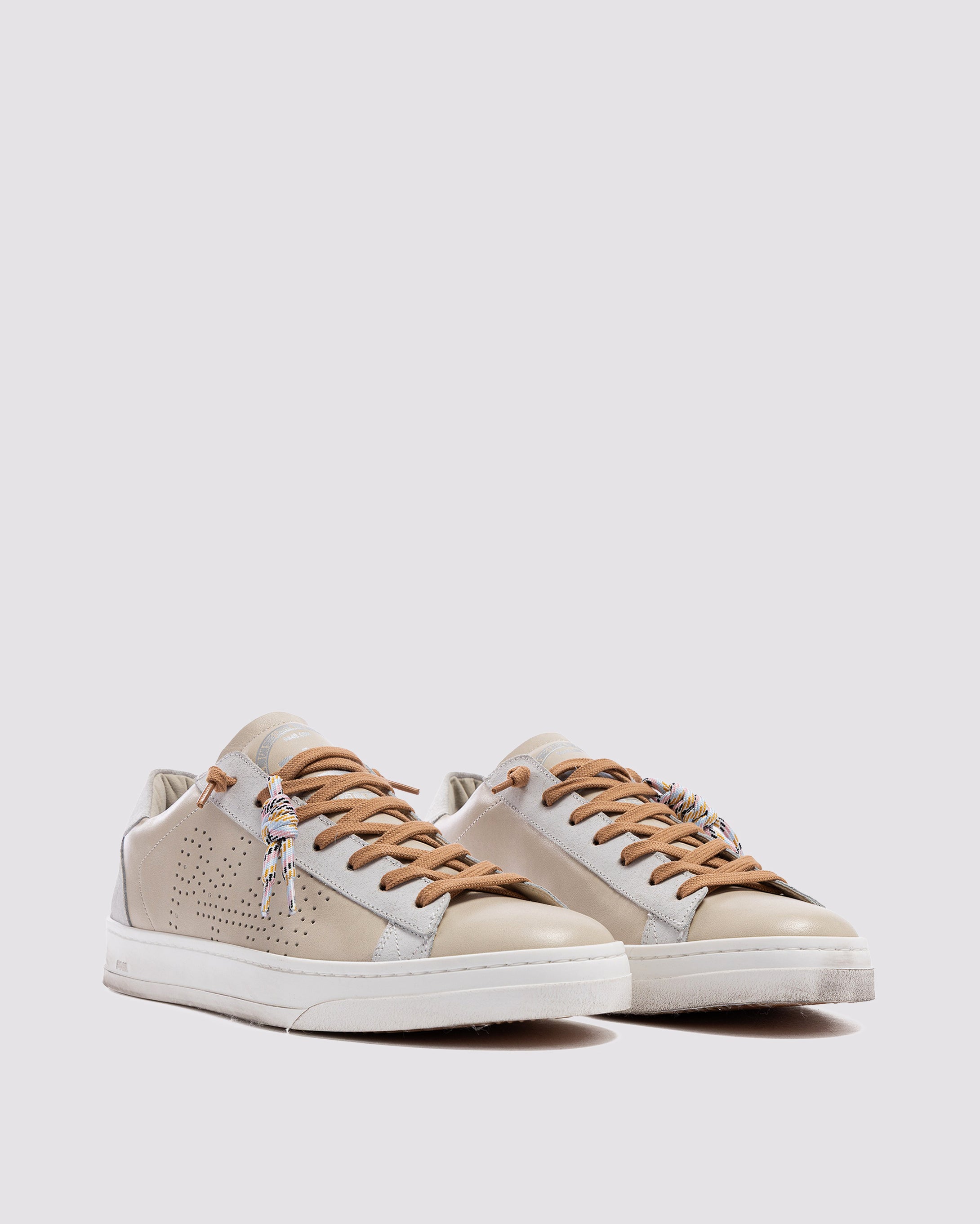 Side angle of beige sneakers