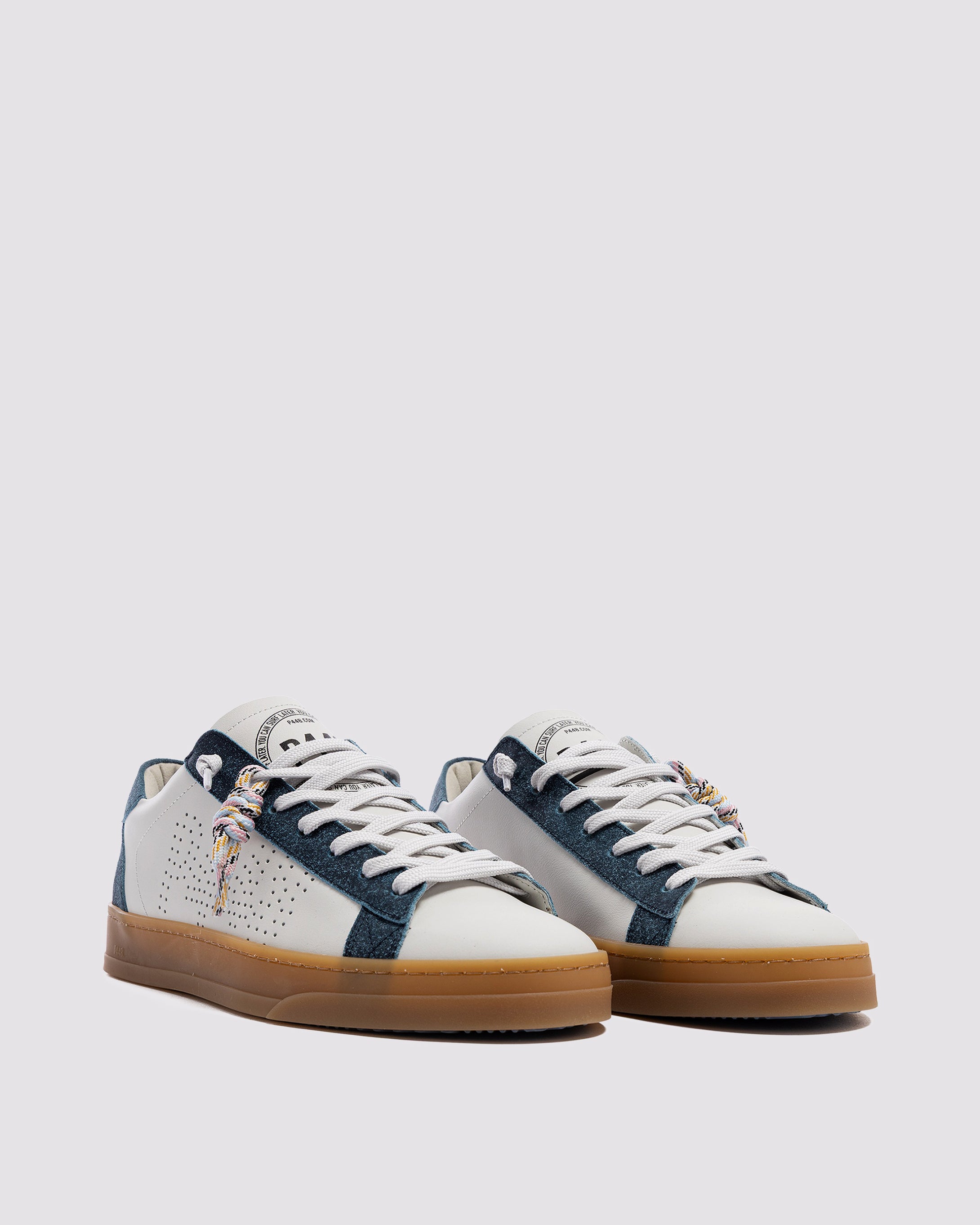 Side angle of white and blue sneakers