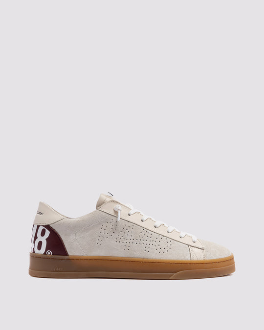Side angle ofbeige with burgundy laces sneakers
