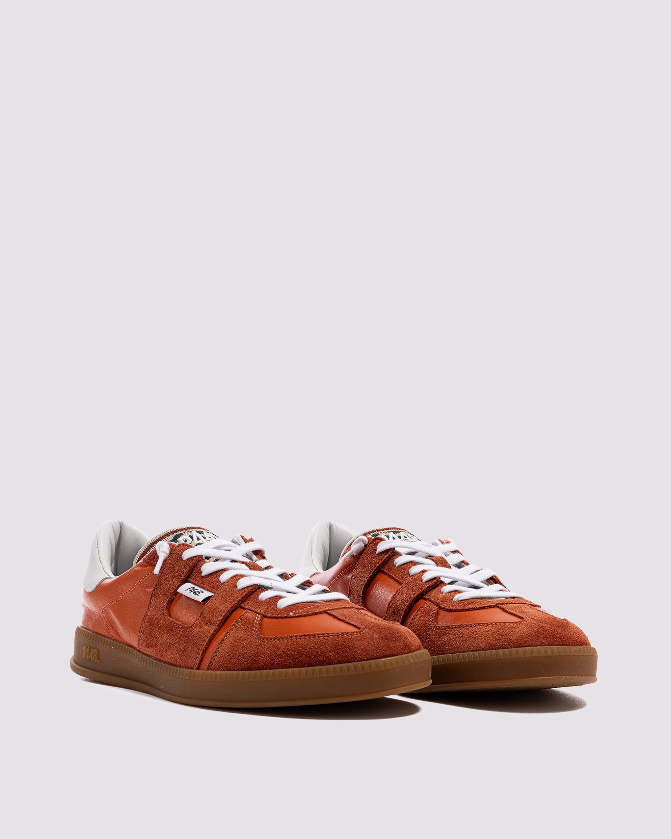 Side angle of orange sneakers
