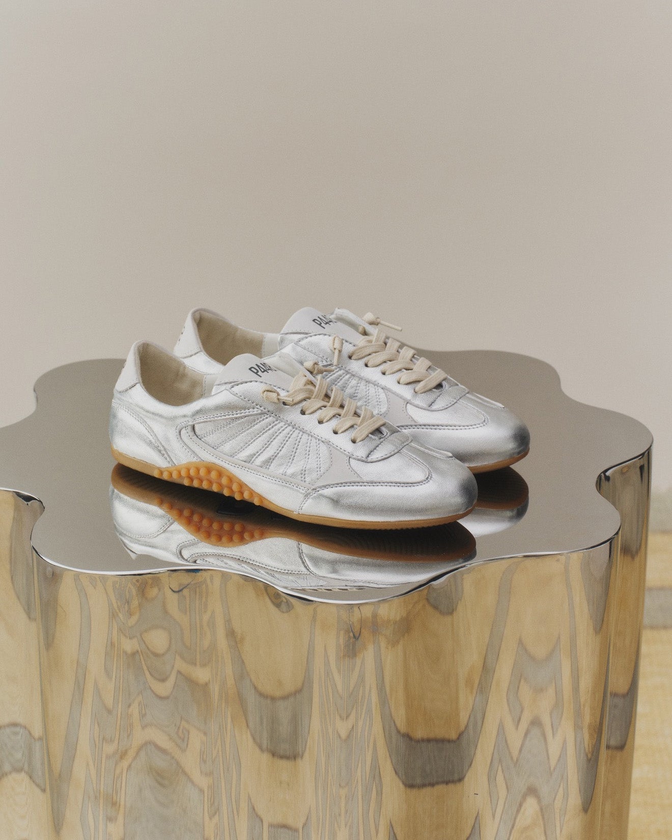 Side angle of silver sneakers