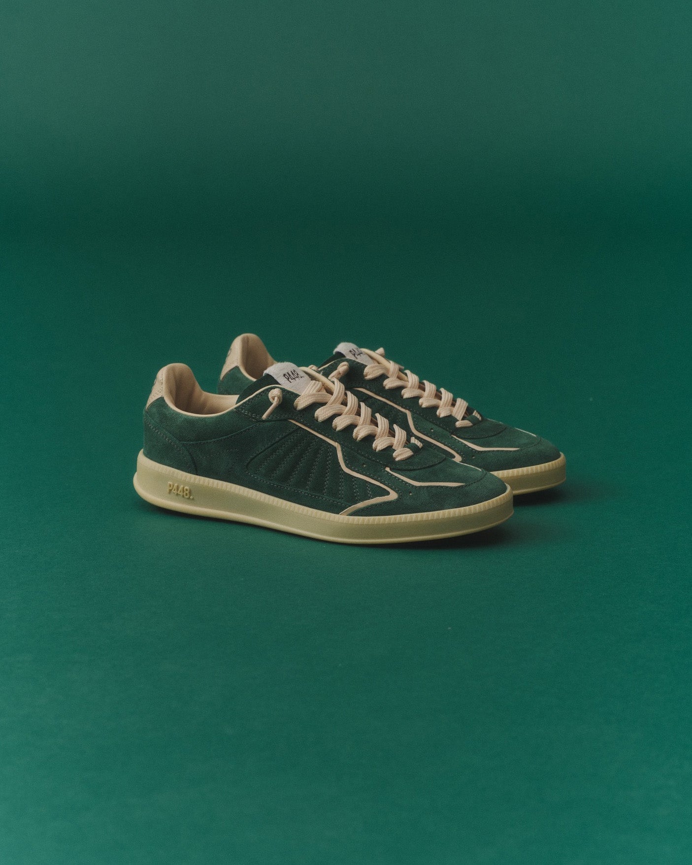 Front angle of green and white sneakers